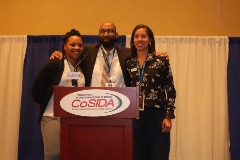 Thompson with past CoSIDA President Rob Knox and current CoSIDA Second Vice President Jessica Poole.